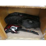 Coffin Cases with Playstation Guitar Hero guitar and drum sticks