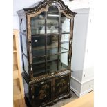 Modern black and gilt decorated Chinese single door glazed display cabinet with 2 doors to base