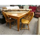 Wooden extending dining table and set of 4 stick back chairs