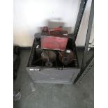 Outdoor storage chest with 2 antique gas stoves and 2 fuel cans