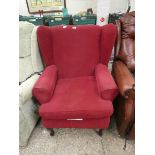 Red upholstered wing back armchair
