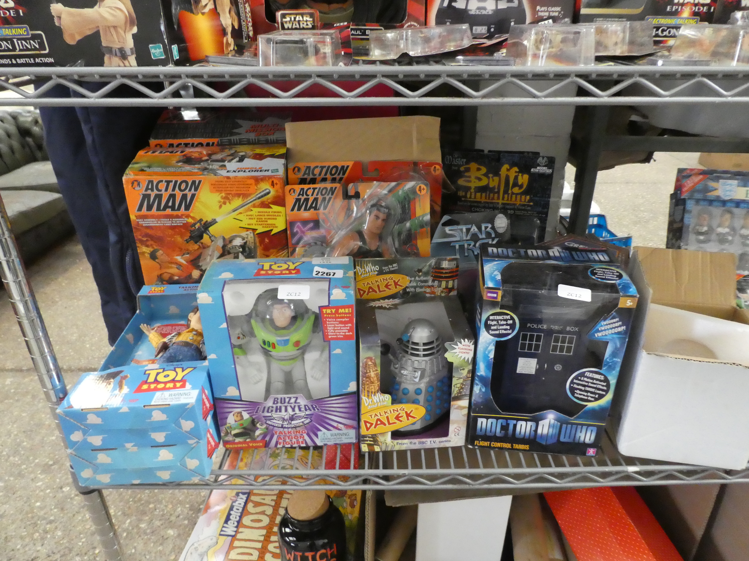 Half shelf of assorted Star Trek, Toy Story and Action Man figures in boxes