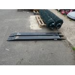 Pair of black forklift tines