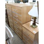 Beech effect bedroom suite comprising 2 5 drawer tall boys and 1 matching 3 drawer bedside
