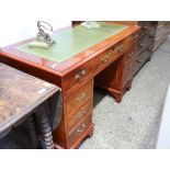 Yew twin pedestal office desk with green leather surface