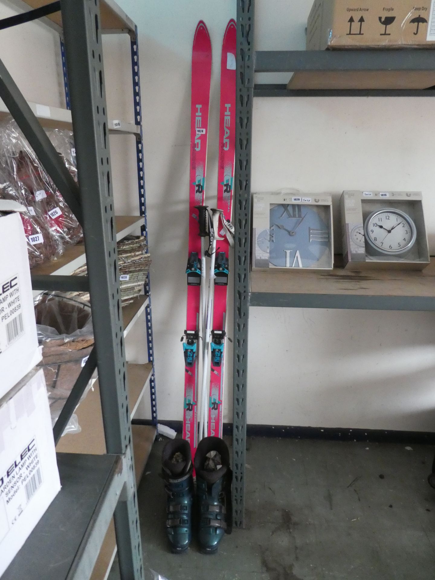 Pair of Head racing skis with poles and pair of skiing boots