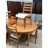 G-Plan circular teak extending dining table with 4 matching cream upholstered dining chairs *