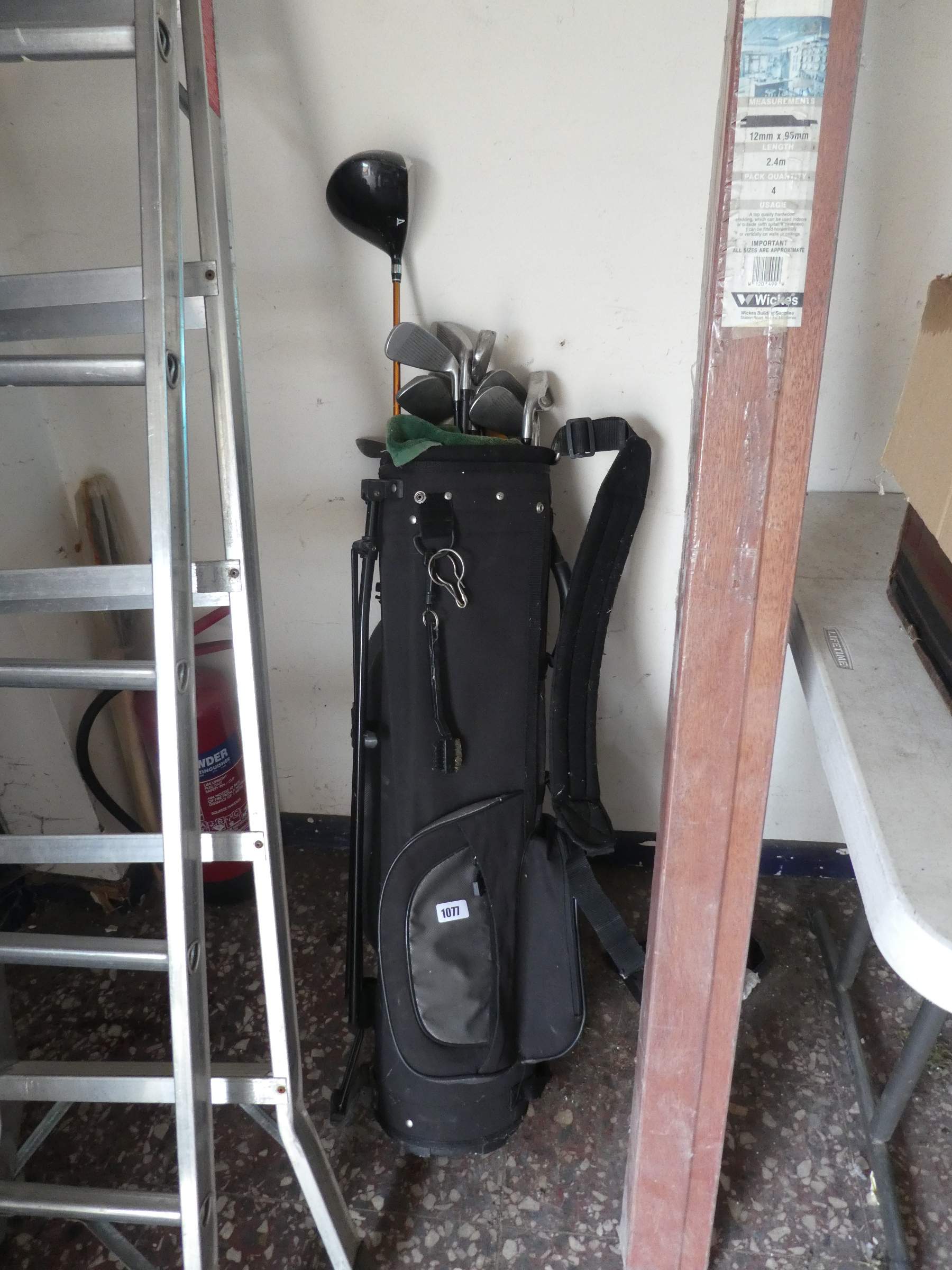Golf bag with assorted Palmer and other golf clubs