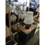 Brass floor standing lantern with 5 glass floral shaped shades