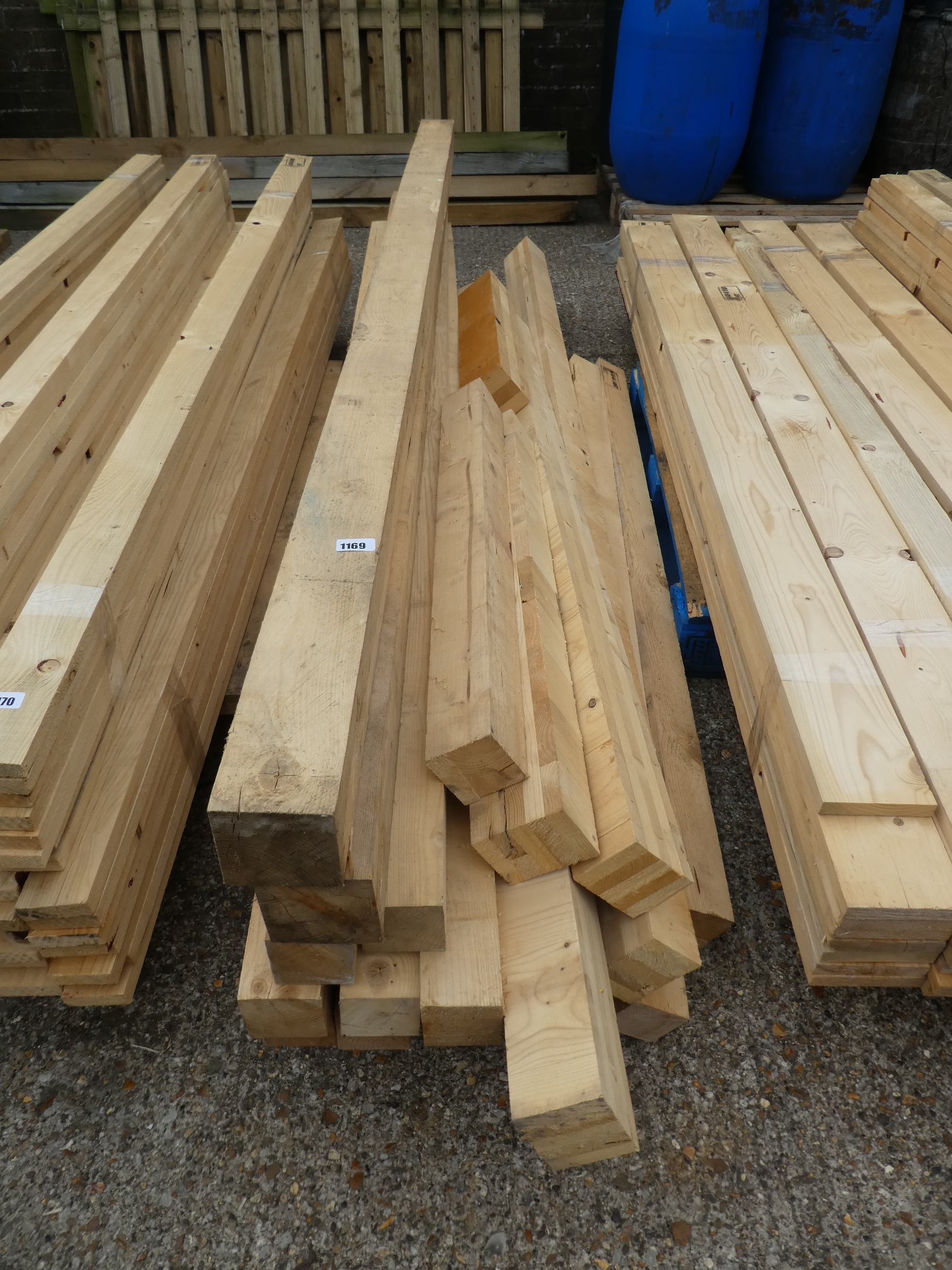 Large stack of 4x4 and 3x3 timbers and smaller posts