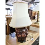 Red glass table lamp base with white shade