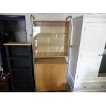 Beech and metal framed display cabinet over double door cupboard