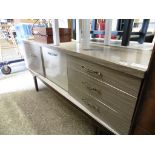 (2062) Formica sideboard with central drinks cabinet flanked by cupboard and drawers