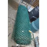 Roll of green plastic fencing