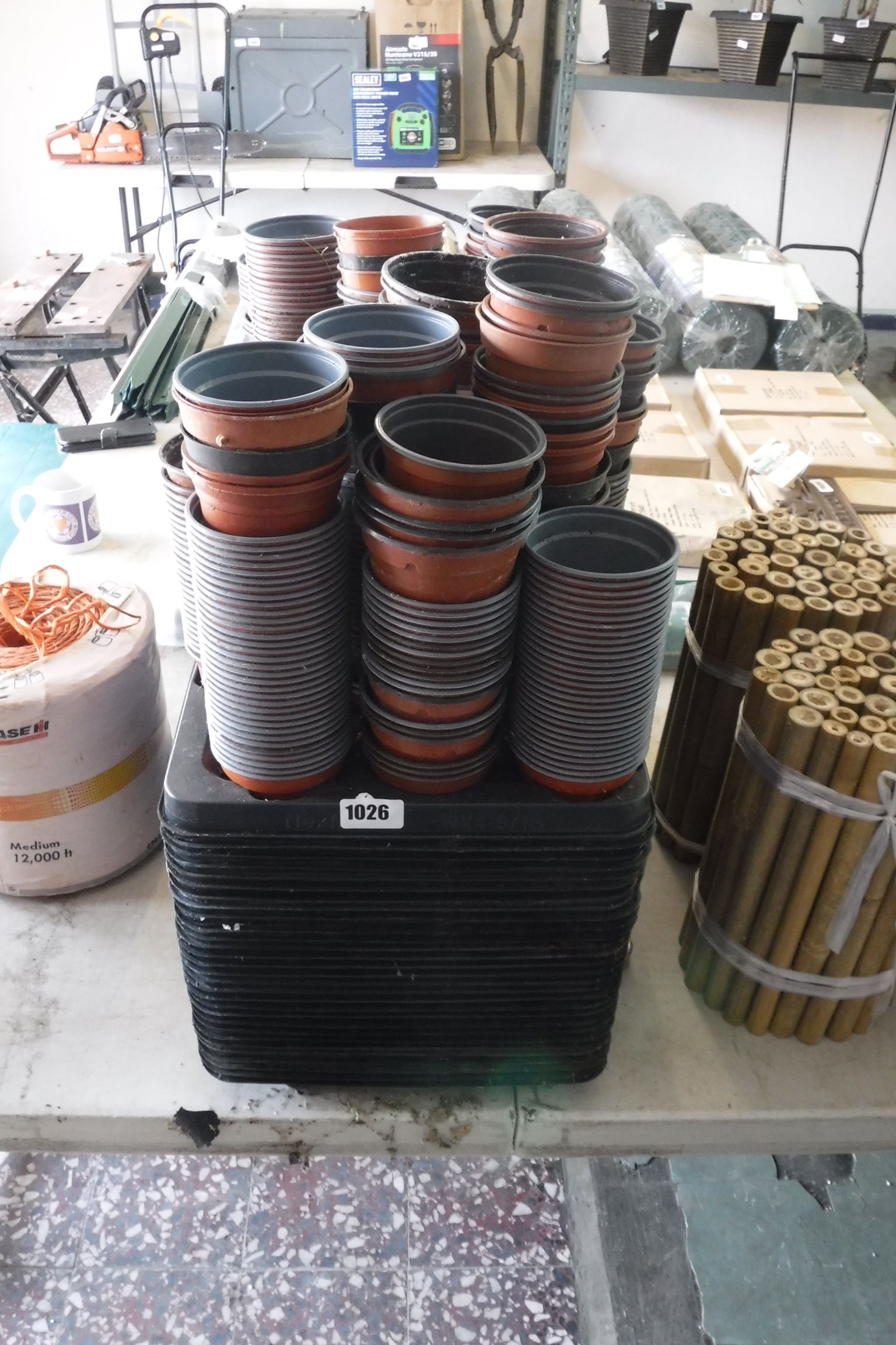 Large quantity of plastic plant trays and plant pots