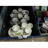 Crate of floral decorated teacups