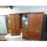 Pine bedroom combination with 2 double wardrobes and central chest of drawers with pair of