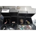 4 black jewellery boxes with contents of necklace and pendants