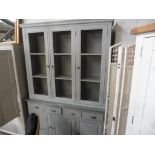 Grey painted kitchen dresser of 4 drawers over cupboards with 3 cupboards over with mesh doors
