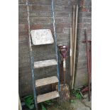 Metal 3 tread stepladder with fork, shovel, rake, scythe, etc.