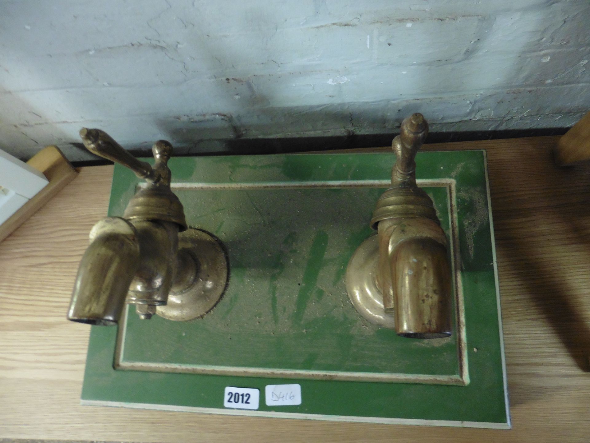 Mounted pair of vintage brass taps
