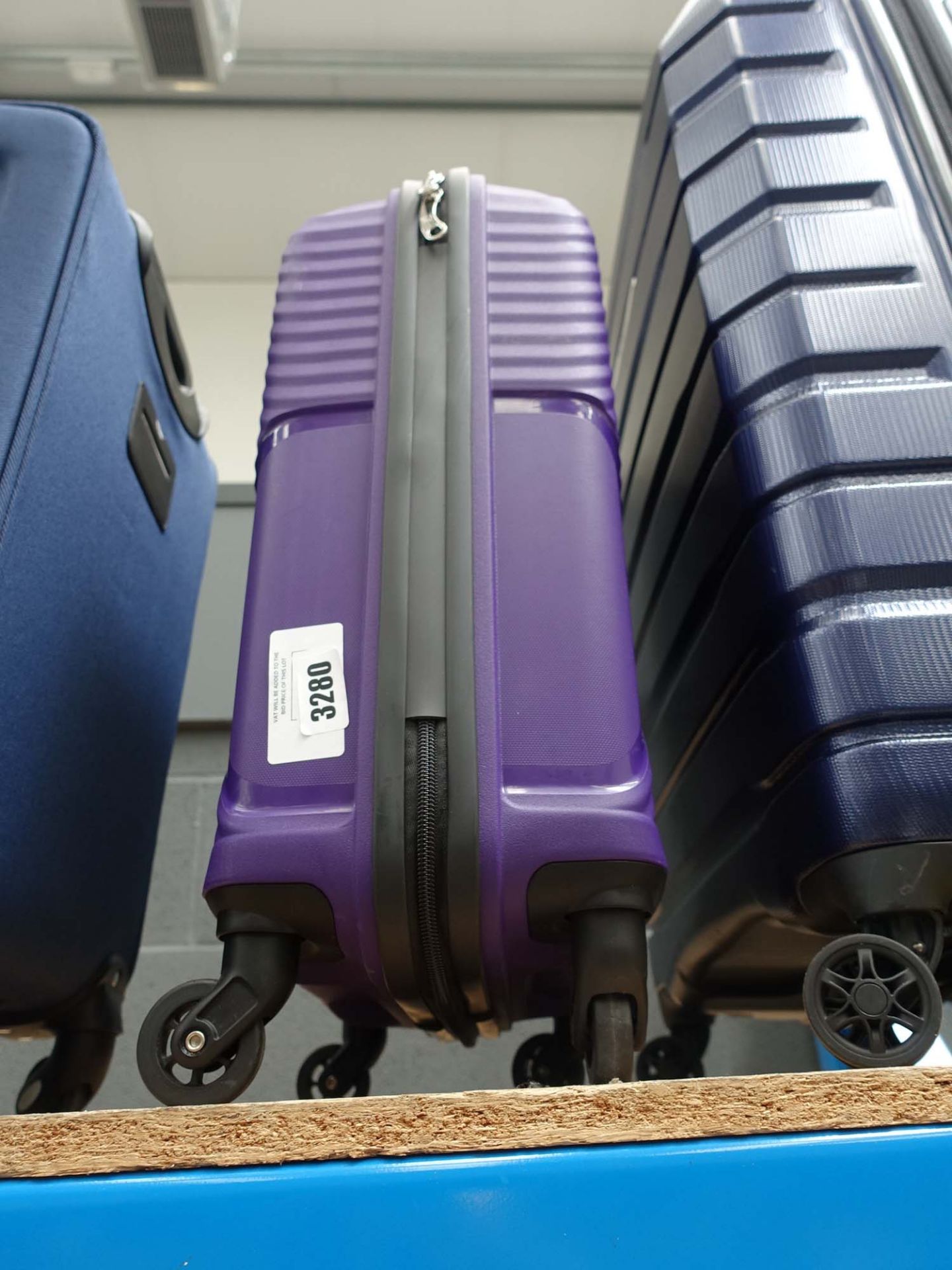 3204 Small purple hard cased suitcase