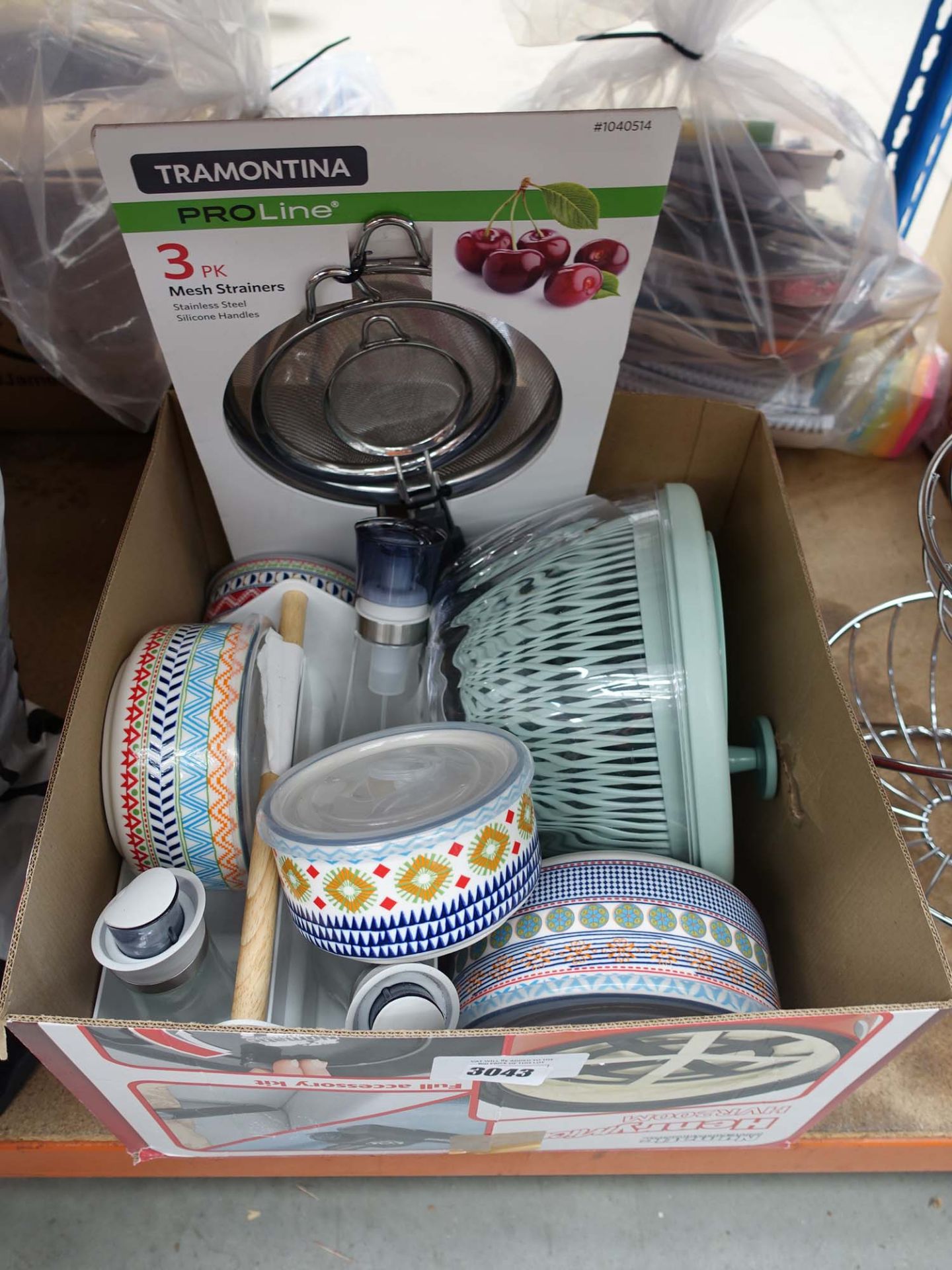 Box of assorted lidded storage jars, sieves, veg spinner, and stainless steel fruit rack