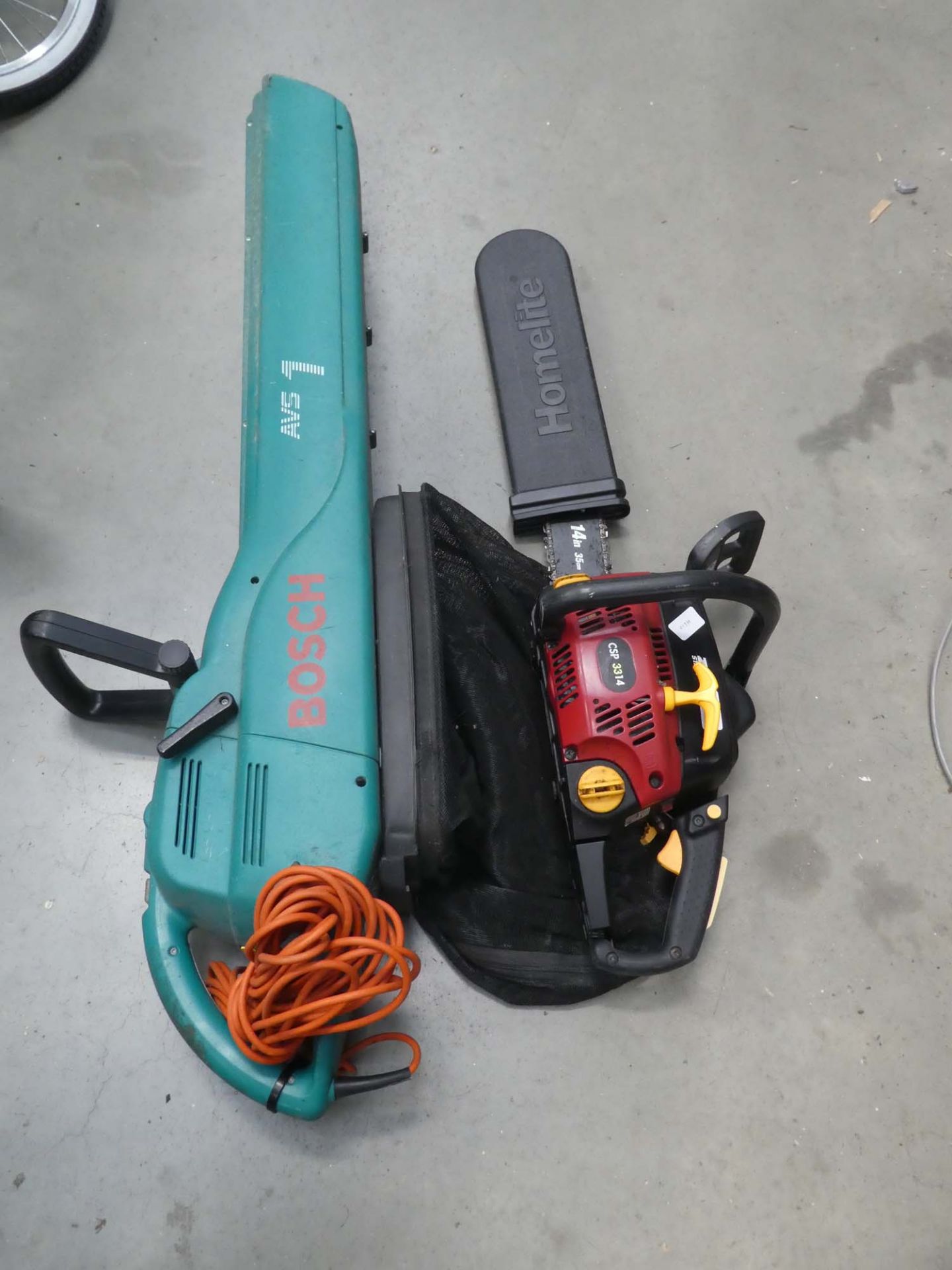 Red petrol powered chainsaw and Bosch electric blow vac