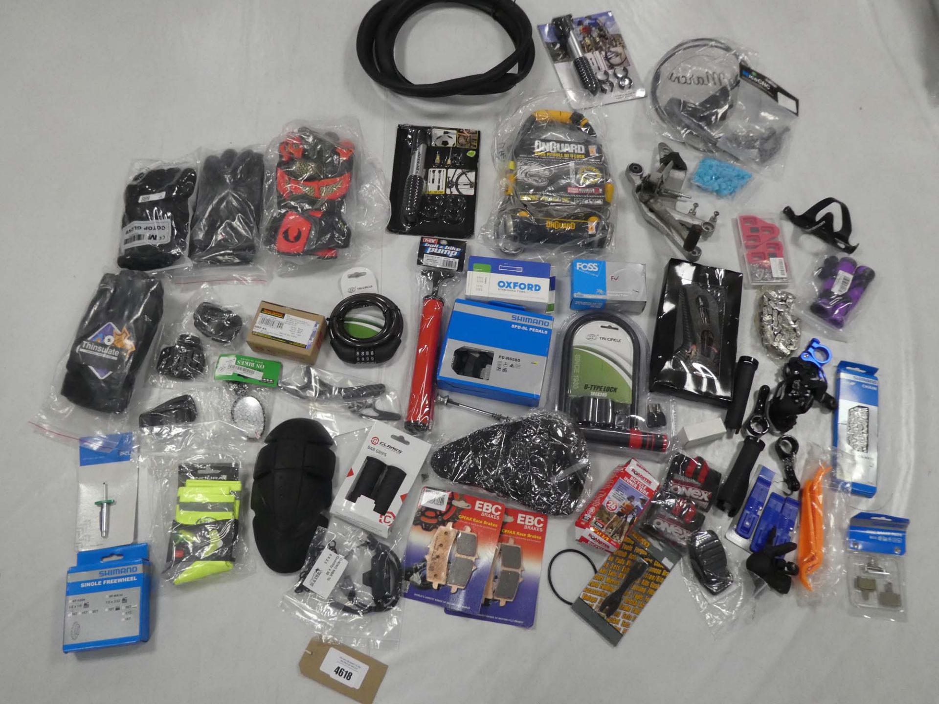 Selection of biking equipment, including chains, pedals, puncture repair items, gloves etc