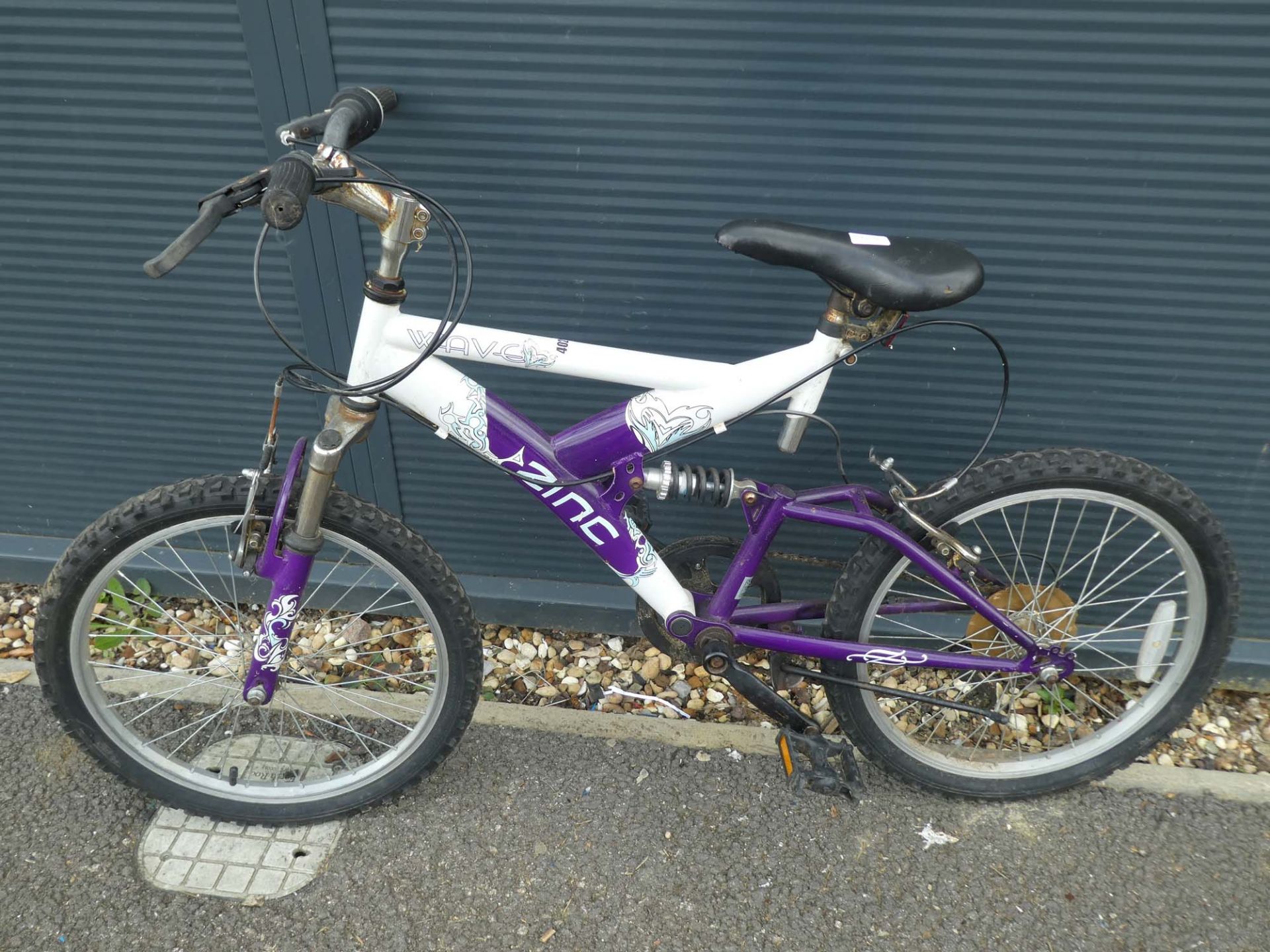 Purple and white childs suspension mountain bike