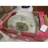 Box containing bird patterned collectors plates