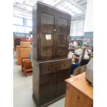 2128L 66 - Oak bookcase with glazed and leaded doors, cupboard base under