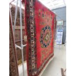 (3) Red woolen carpet with geometric and floral pattern