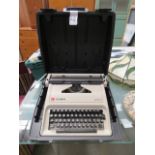 Cased Olympia typewriter with ribbons