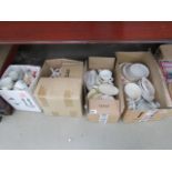4 boxes containing various cups and saucers and dinner plates