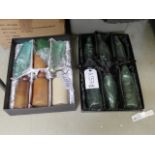 2 boxes containing glass bottles and ginger beer bottles