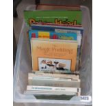 Box containing children's annuals and railway reference books