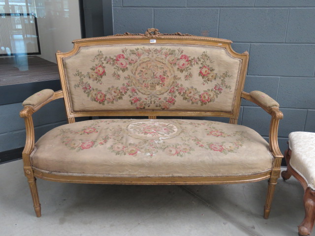 2 seater settee in floral fabric with gilt painted exposed frame