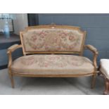2 seater settee in floral fabric with gilt painted exposed frame