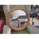 Circular bevelled mirror in gilt frame