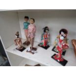 6 Oriental dolls