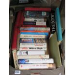 Box containing autobiographies, Wilbur Smith and other novels