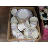 Box containing a quantity of floral patterned cup saucers and side plates