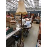 Metal floor lamp with globe shaped glass shade plus a turned wooden floor lamp