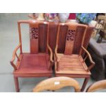 Pair of carved Chinese armchairs (af)