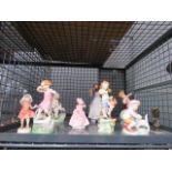 Cage containing quantity of Royal Doulton, Royal Worcester and other figures