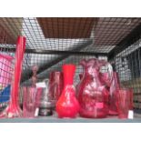 Cage containing Cranberry coloured glass jugs and vases