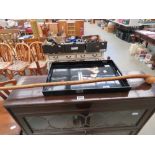 Black lacquered serving tray plus a walking stick