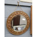 Small circular bevelled mirror in gold painted metal frame