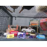 Cage containing Bburago and other die cast cars
